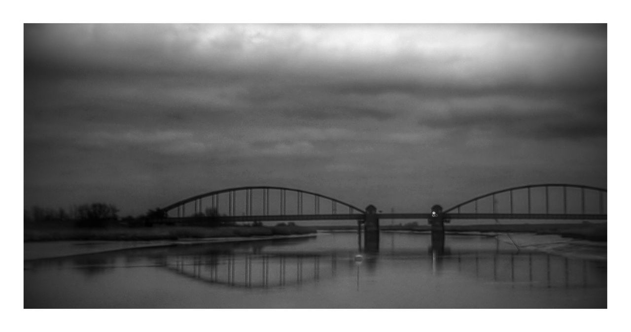 BRIDGE OVER RIVER AGAINST SKY