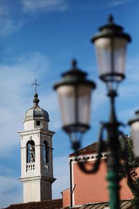 Low angle view of bell tower against sky