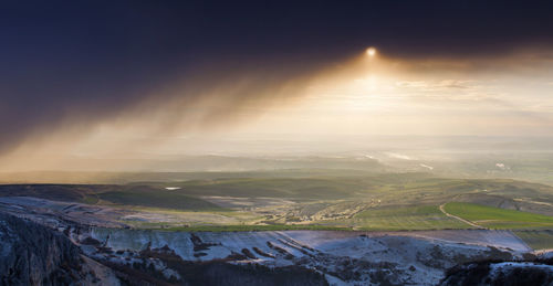 Aerial view of landscape against sky during winter