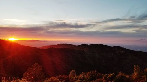 Scenic view of mountains against sky during sunset