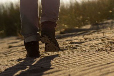 Low section of man wearing shoes