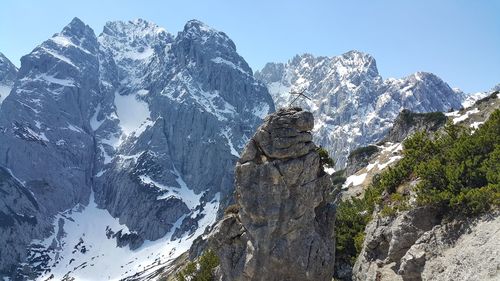 Scenic view of kaiser mountains against clear sky during winter