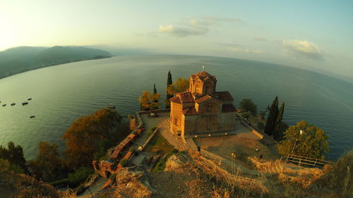 High angle view of sea and buildings against sky