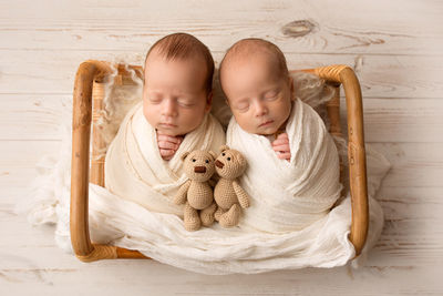 Portrait of cute baby boy with teddy bear