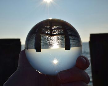Close-up of christmas lights against sky