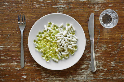 Directly above shot of chopped vegetables on table