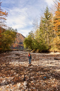 Full length of boy on field during autumn