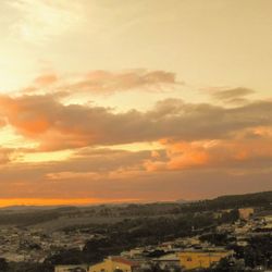 High angle view of townscape against sky at sunset