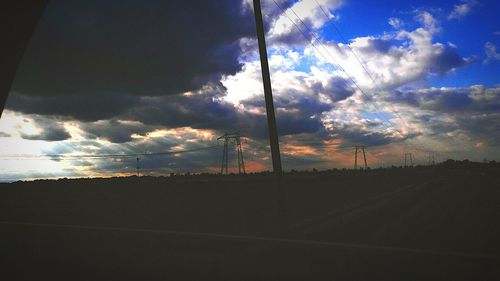 Scenic view of landscape against cloudy sky