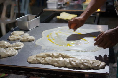 Close-up of person preparing food