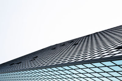 Low angle view of modern building against clear sky