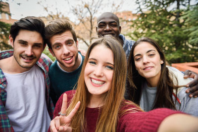 Portrait of happy friends standing outdoors