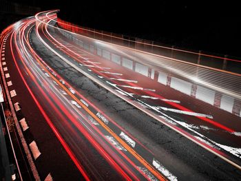 High angle view of light trails on road at night