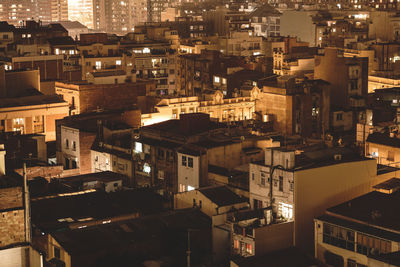 High angle view of illuminated buildings in city