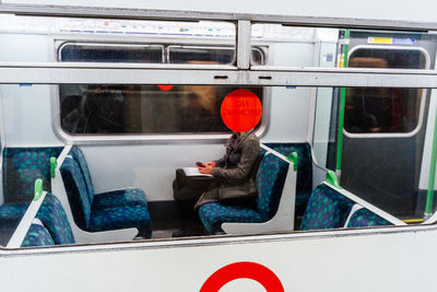 Woman sitting in train