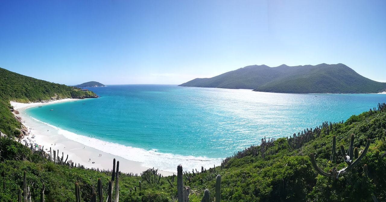 water, scenics - nature, tree, sea, beauty in nature, sky, plant, tranquil scene, tranquility, land, blue, beach, mountain, nature, day, no people, idyllic, non-urban scene, green color, outdoors, turquoise colored, bay