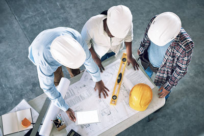 High angle view of man working on table