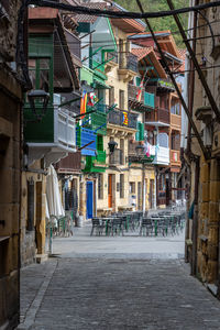 Alley amidst buildings in city