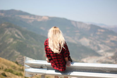 Rear view of woman looking at mountains