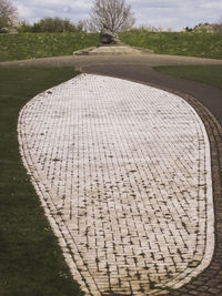 High angle view of footpath amidst field