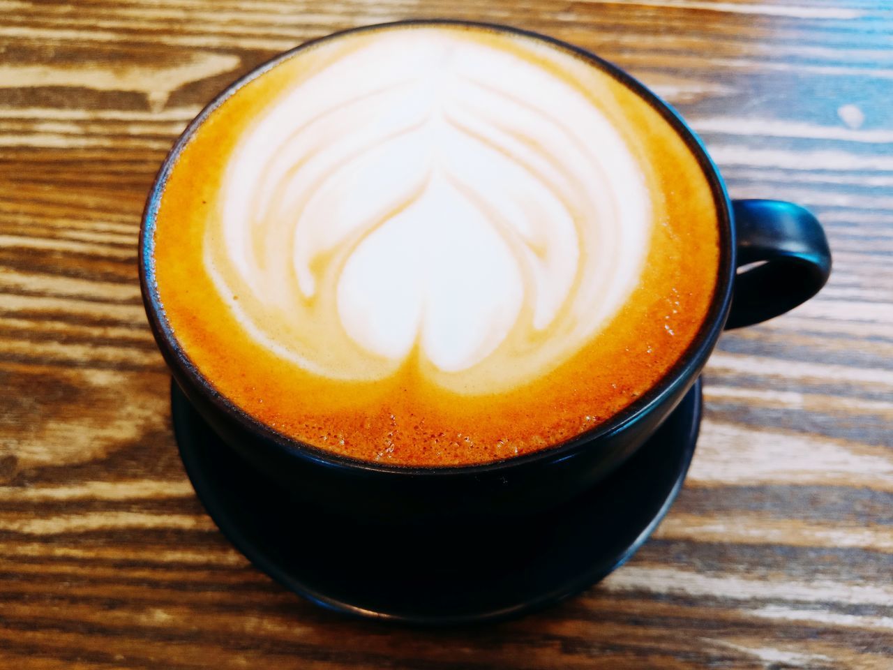 CLOSE-UP OF COFFEE SERVED ON TABLE