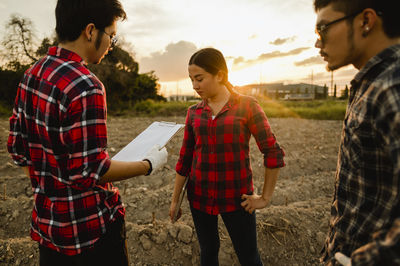 Young couple standing outdoors