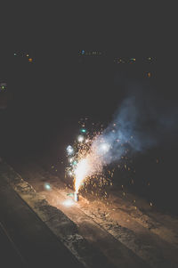 View of firework display at night