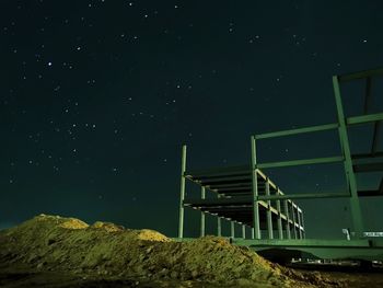 Low angle view of built structure against sky at night