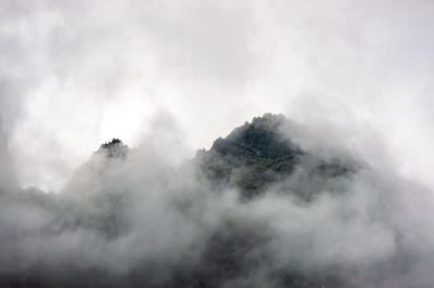 Mountain against sky during foggy weather
