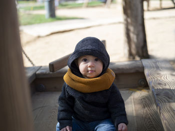 Portrait of cute baby girl in warm clothes