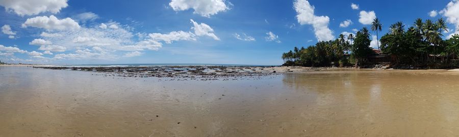 Panoramic view of beach against sky