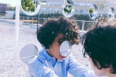 Reflection of man in glass wall