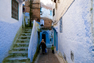 Rear view of man walking on street