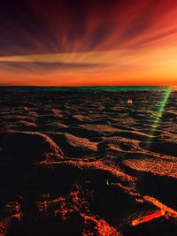 Aerial view of sea against sky during sunset