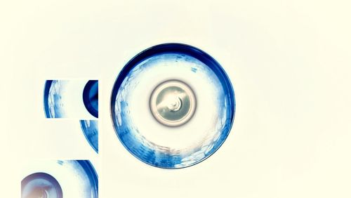 Close-up of blue over white background