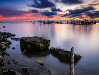 Scenic view of lake against sky during sunset