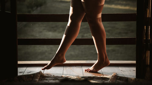 Low section of woman standing on floor