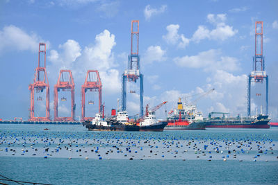 Boats in sea against sky