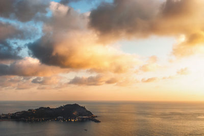 Scenic view of sea against sky at sunset