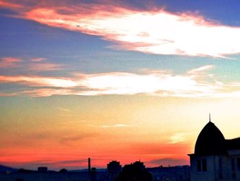 Scenic view of dramatic sky at sunset