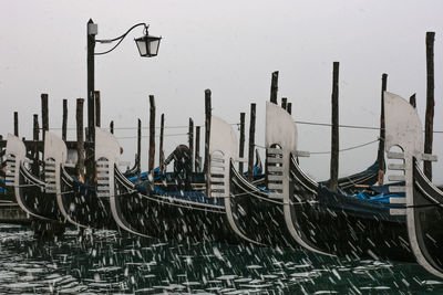 Boats moored at harbor