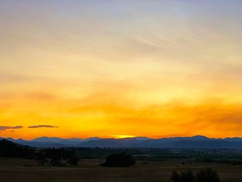 Scenic view of silhouette landscape against sky during sunset