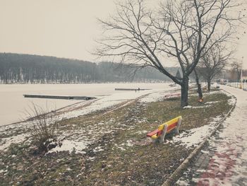 Snow on field against sky during winter