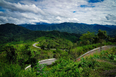 High angle view of green landscape against sky