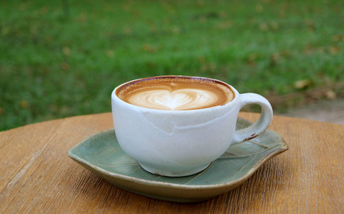 Close-up of cappuccino on table