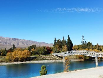 View of swimming pool in lake against blue sky