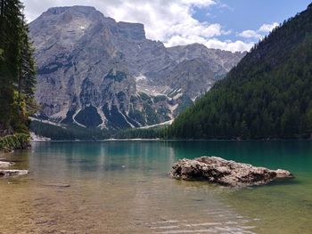 Scenic view of lake and mountains against sky