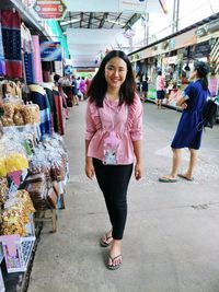 Full length of woman standing in market