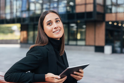 Young woman using phone