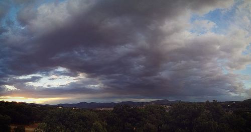 Scenic view of landscape against cloudy sky